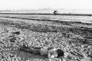 Pablo Bartholomew | Man Asleep on Chowpatty Beach, Bombay | Circa 1979 | Archival pigment prints (Ed 2|10) | 16 x 24 Inches